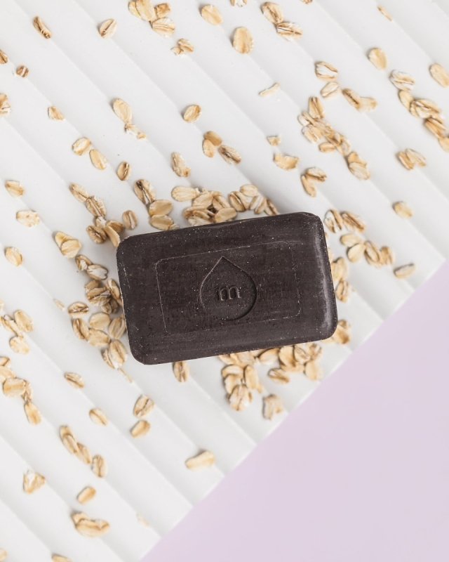 A single green leaf against a white background.